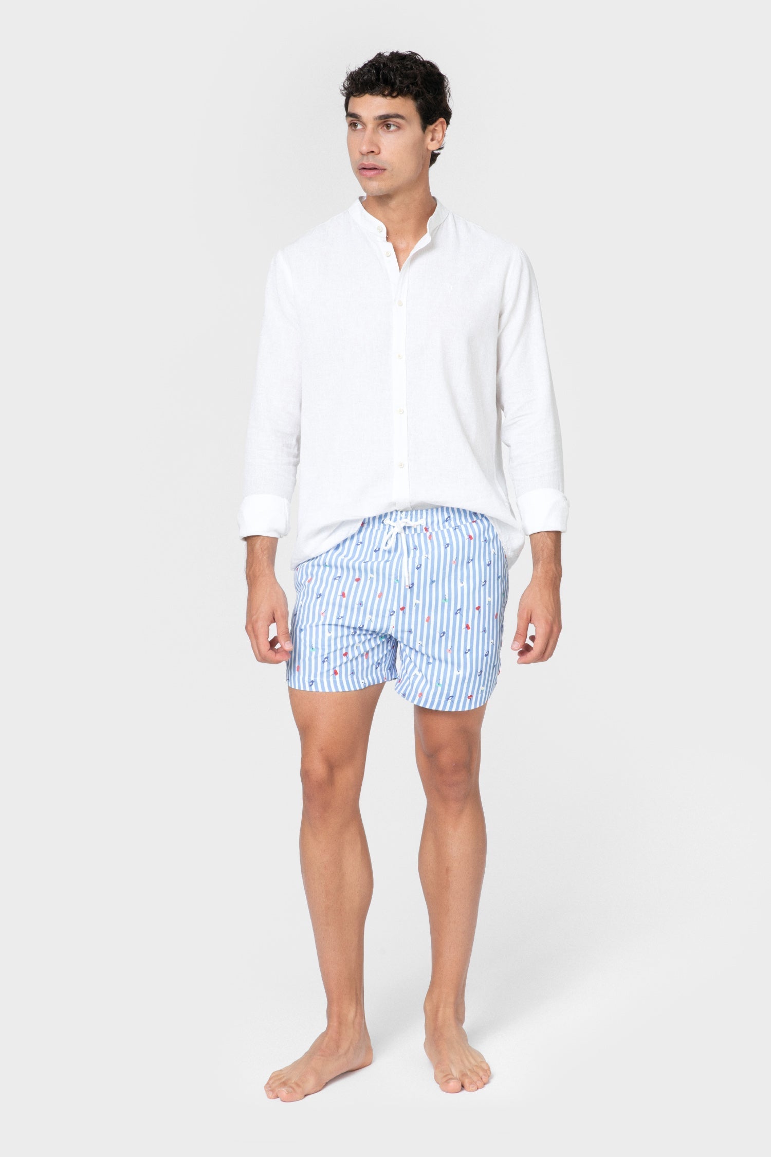 Bañador para hombre de diseño español con estampado de rayas celestes y flores Celopman