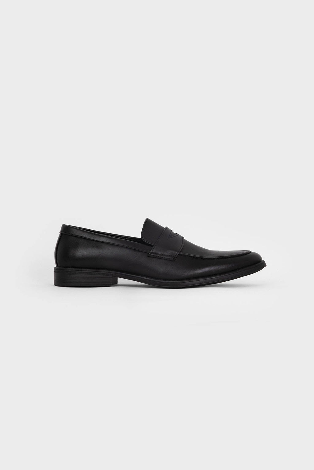 Mocasines negros de hombre con antifaz y puntera redonda