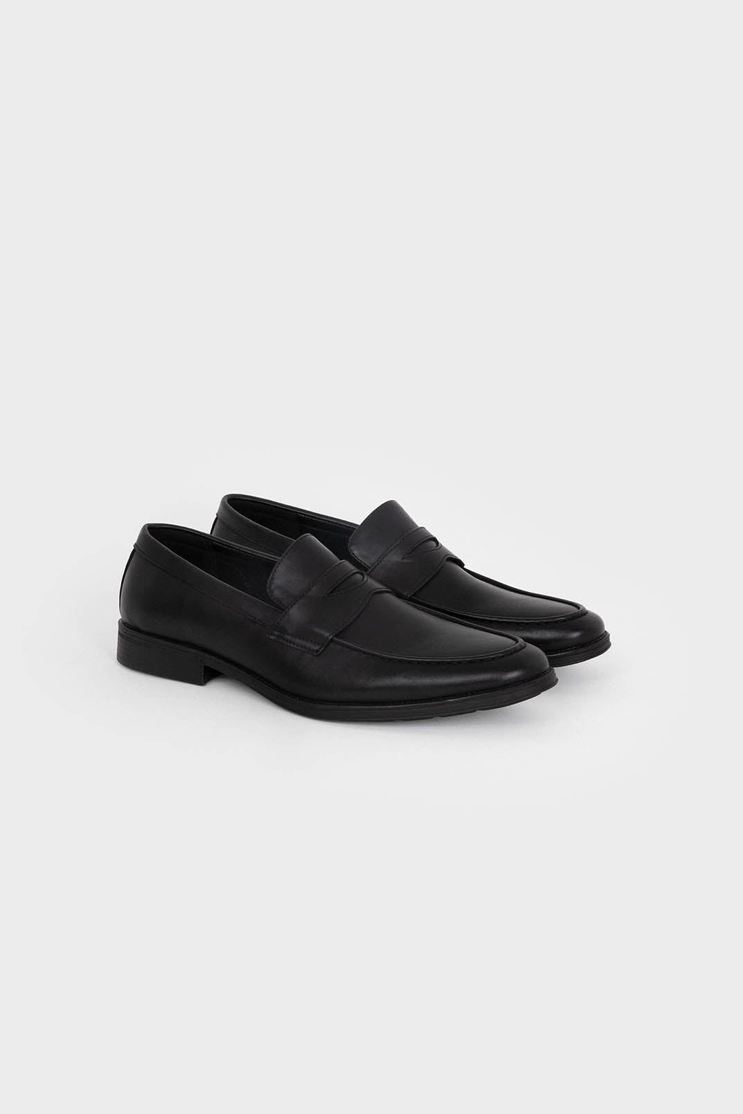 Mocasines negros de hombre con antifaz y puntera redonda