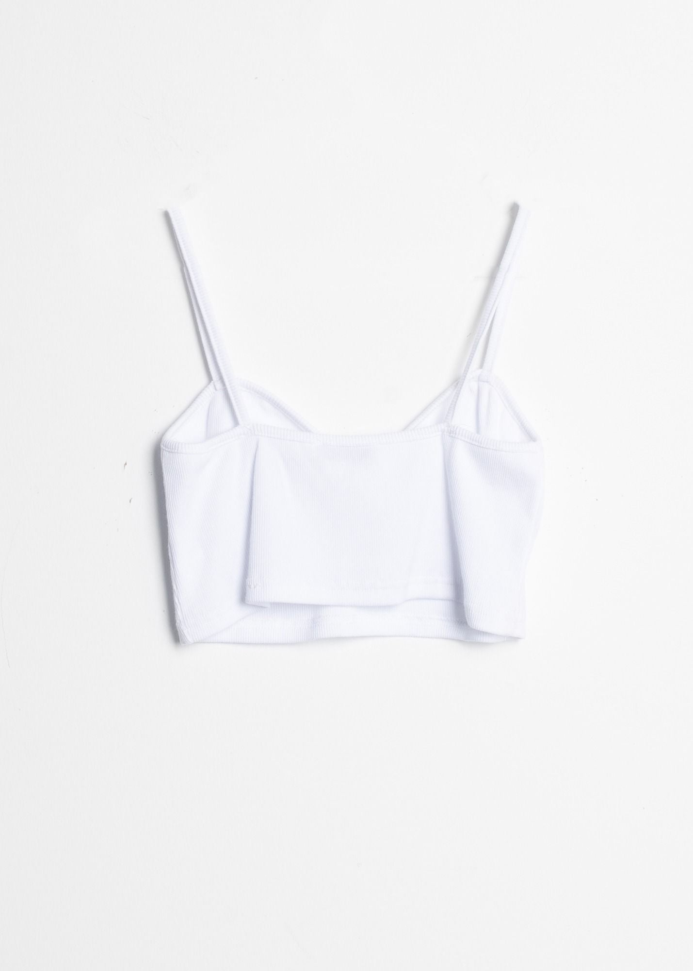 Top de mujer en tejido canalé con frunces en el área del pecho o escote. Diseño Made in Spain.