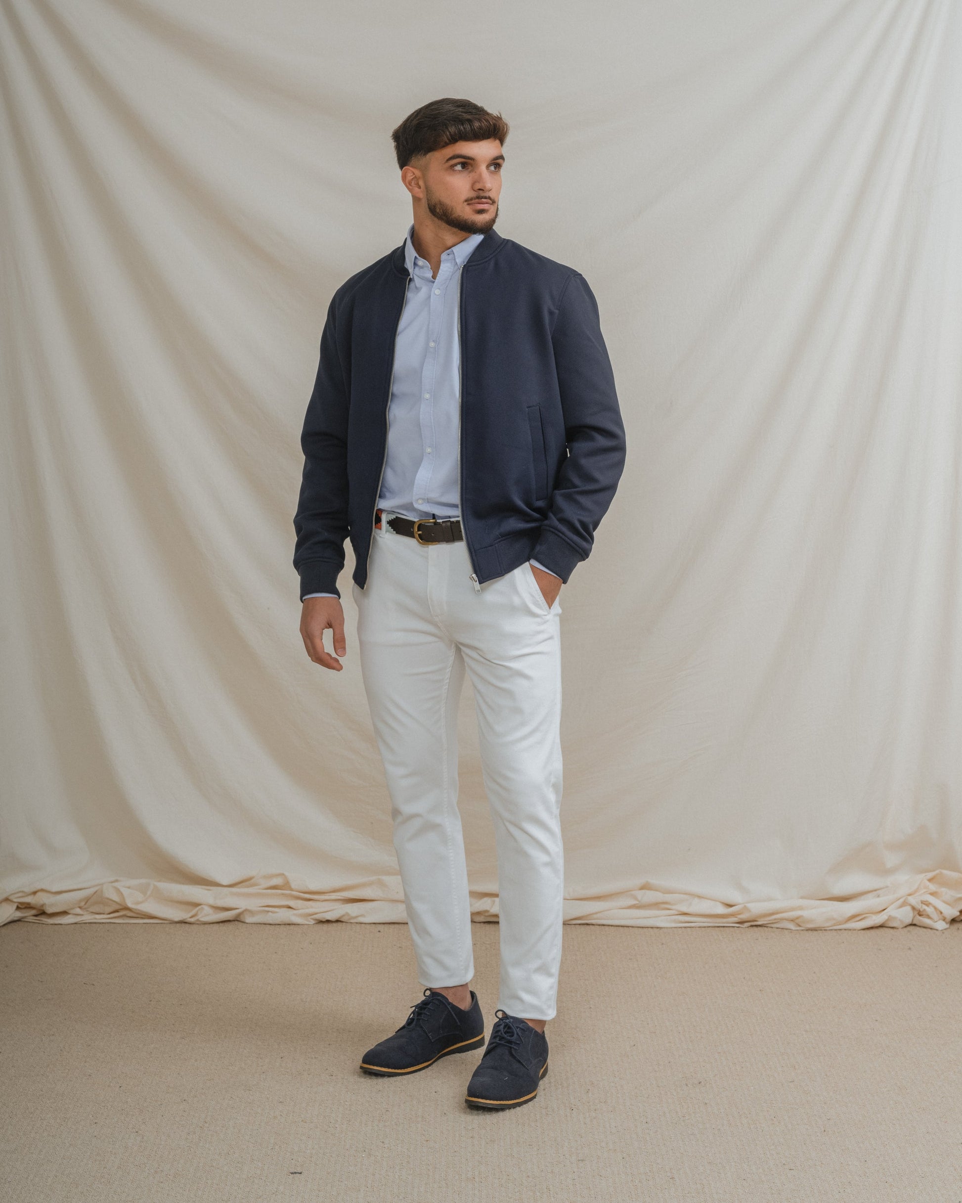 Camisa Oxford azul celeste para hombre con manga larga y detalle de logo.