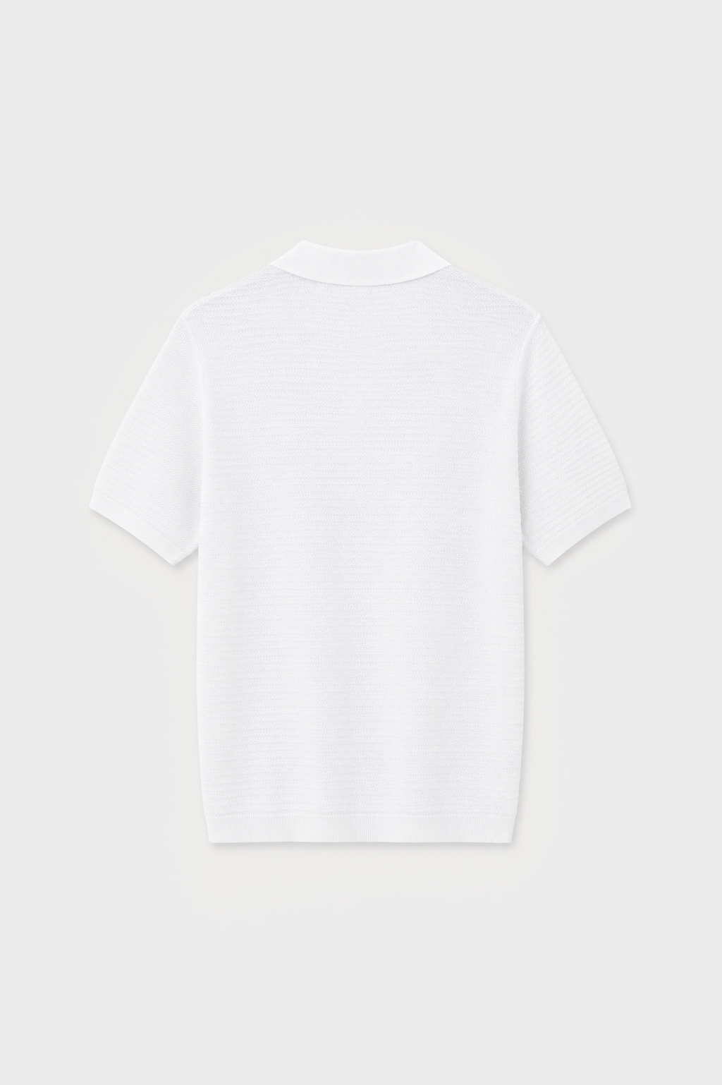Polo de punto blanco con textura y manga corta para hombre