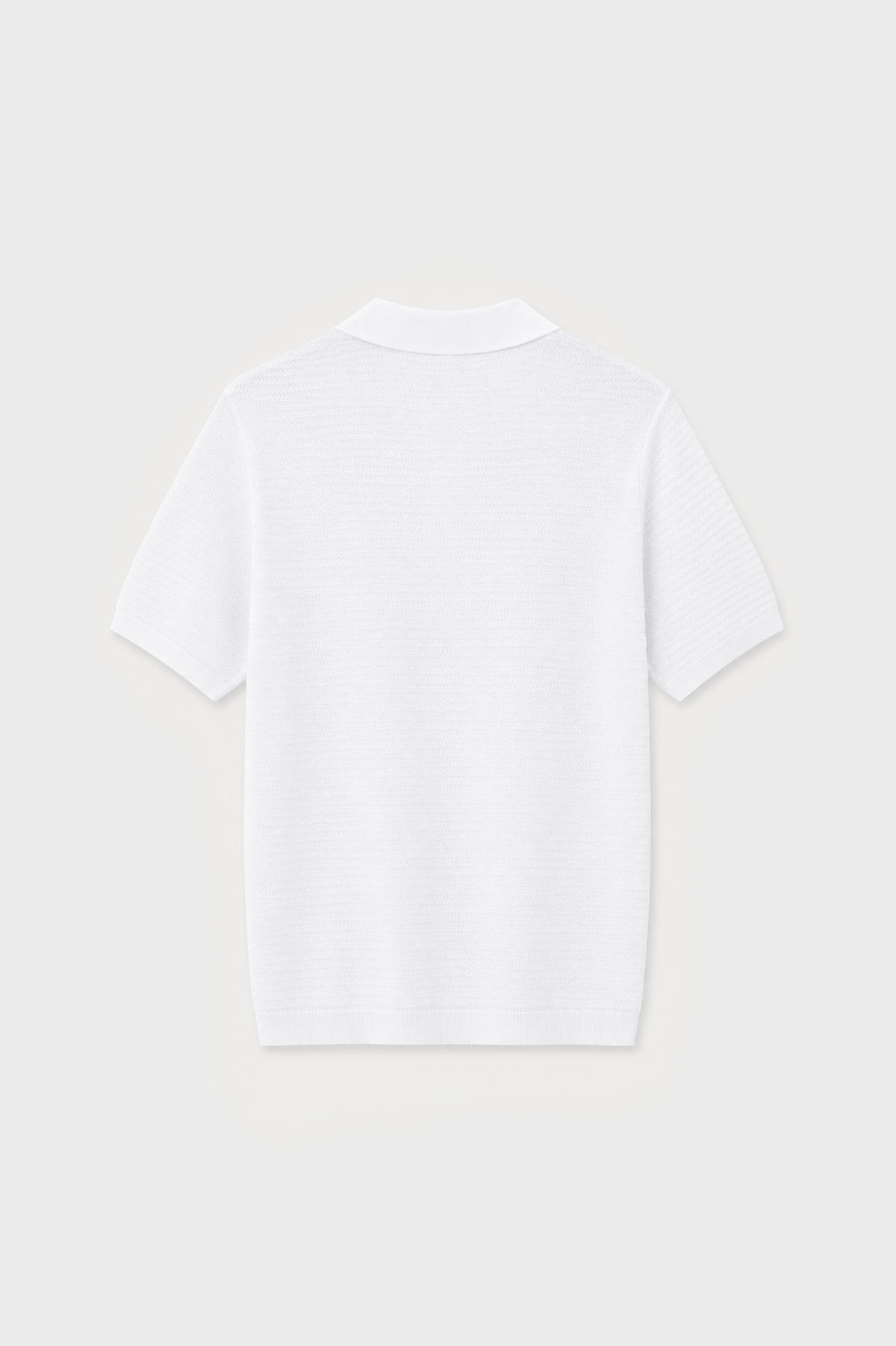 Polo de punto blanco con textura y manga corta para hombre
