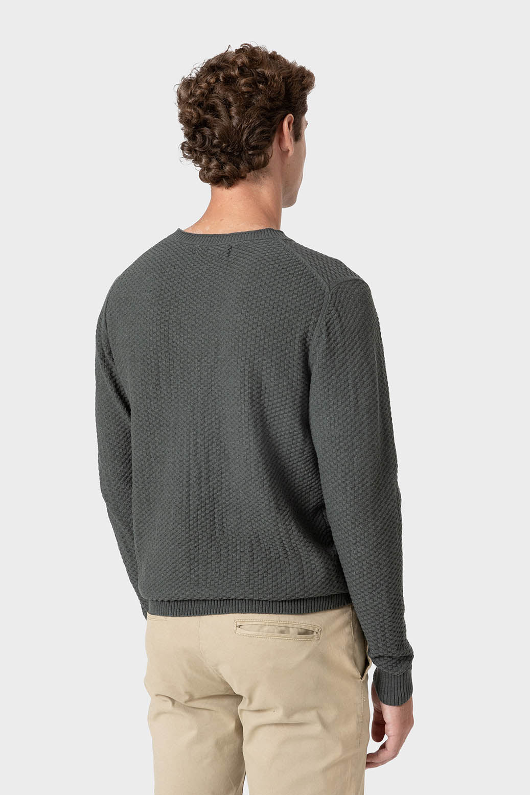 Jersey verde de algodón con textura de ladrillo