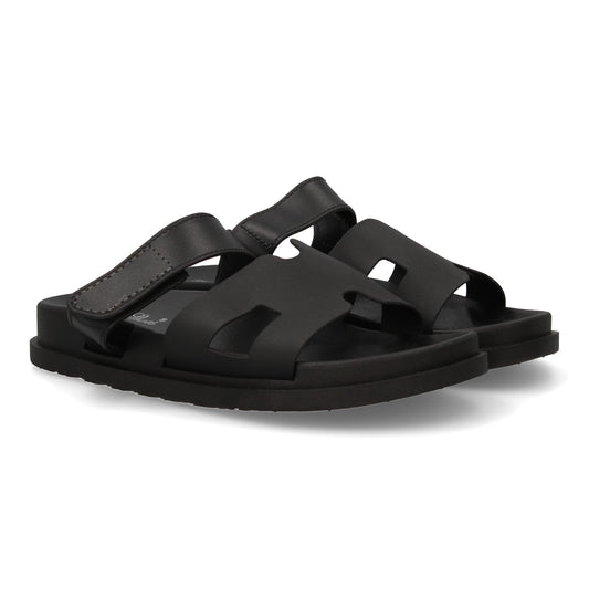 Chanclas negras de mujer con adorno en la pala y cierre de velcro, cómodas para el verano.