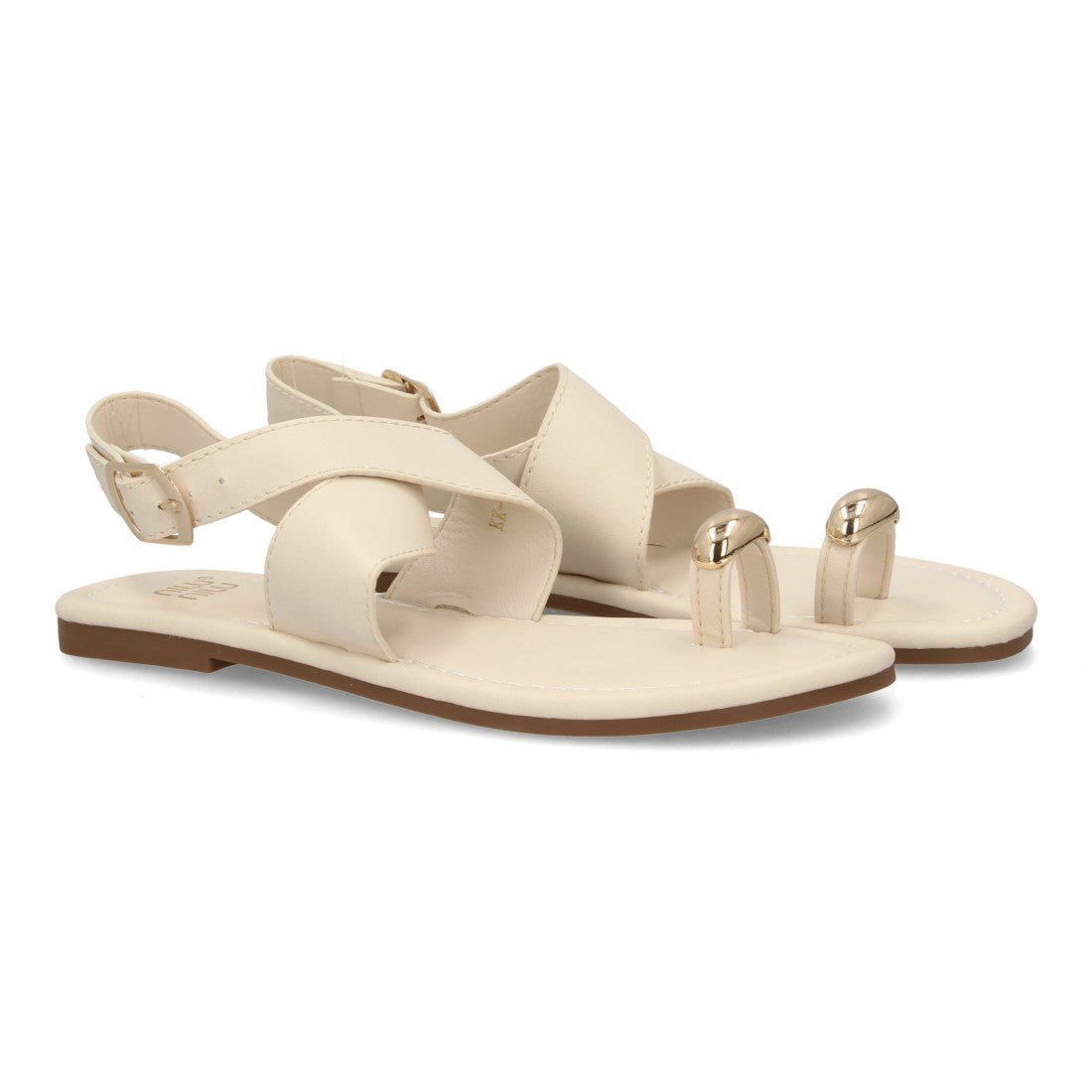 Sandalia plana minimalista beige con tiras cruzadas