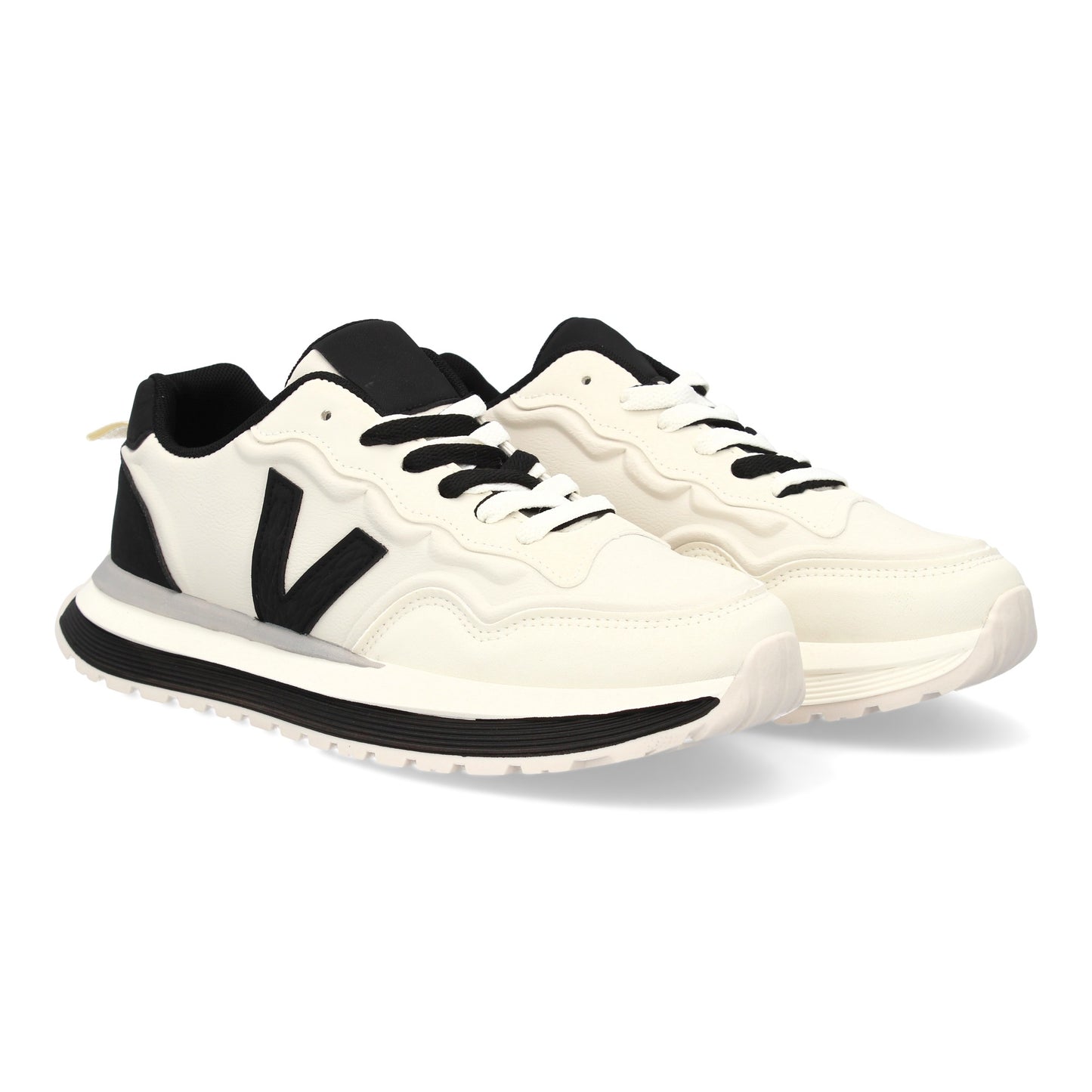 Zapatilla deportiva de hombre blanca con suela dentada y cierre de cremallera.