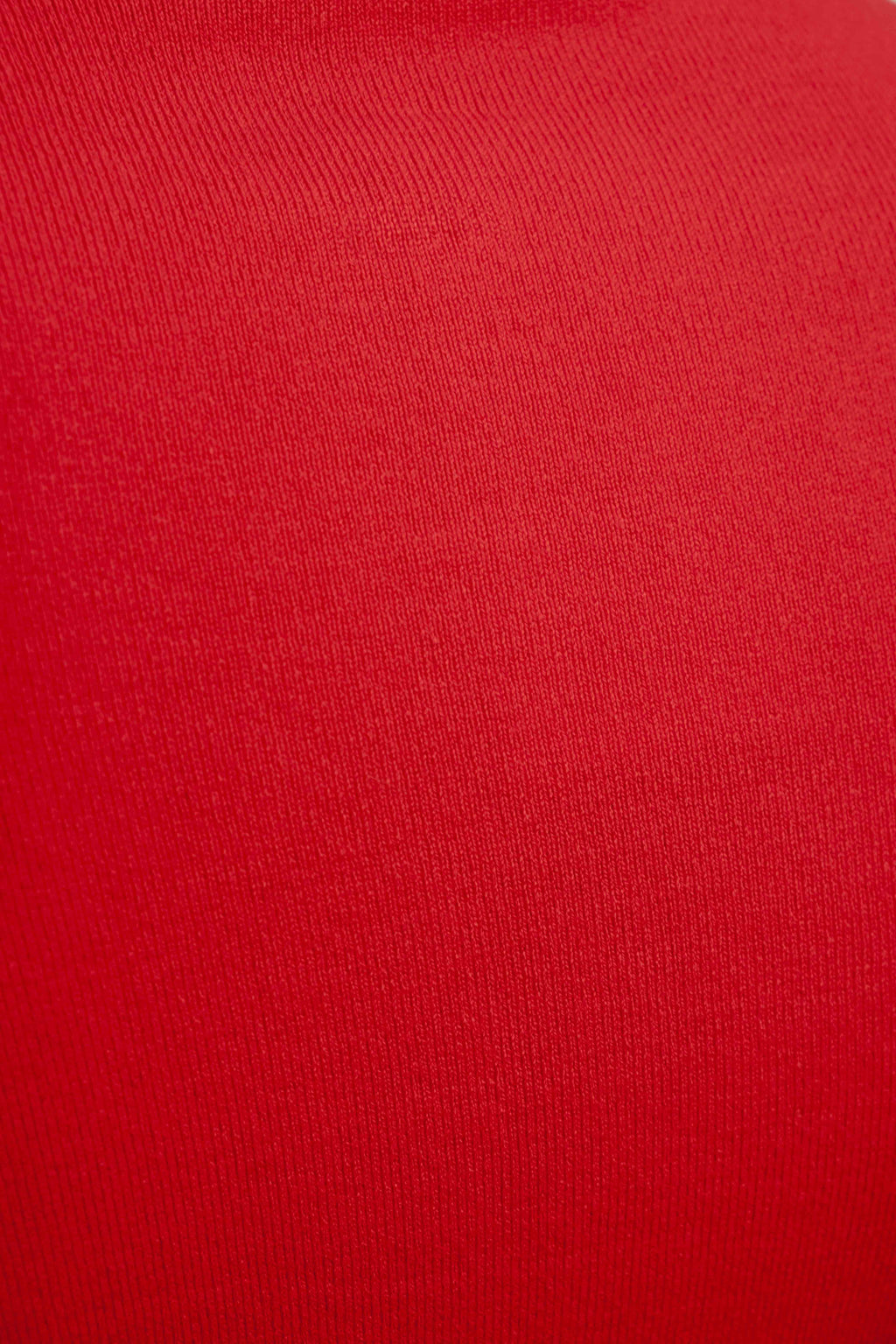 Jersey punto rojo cuello subido aberturas puños