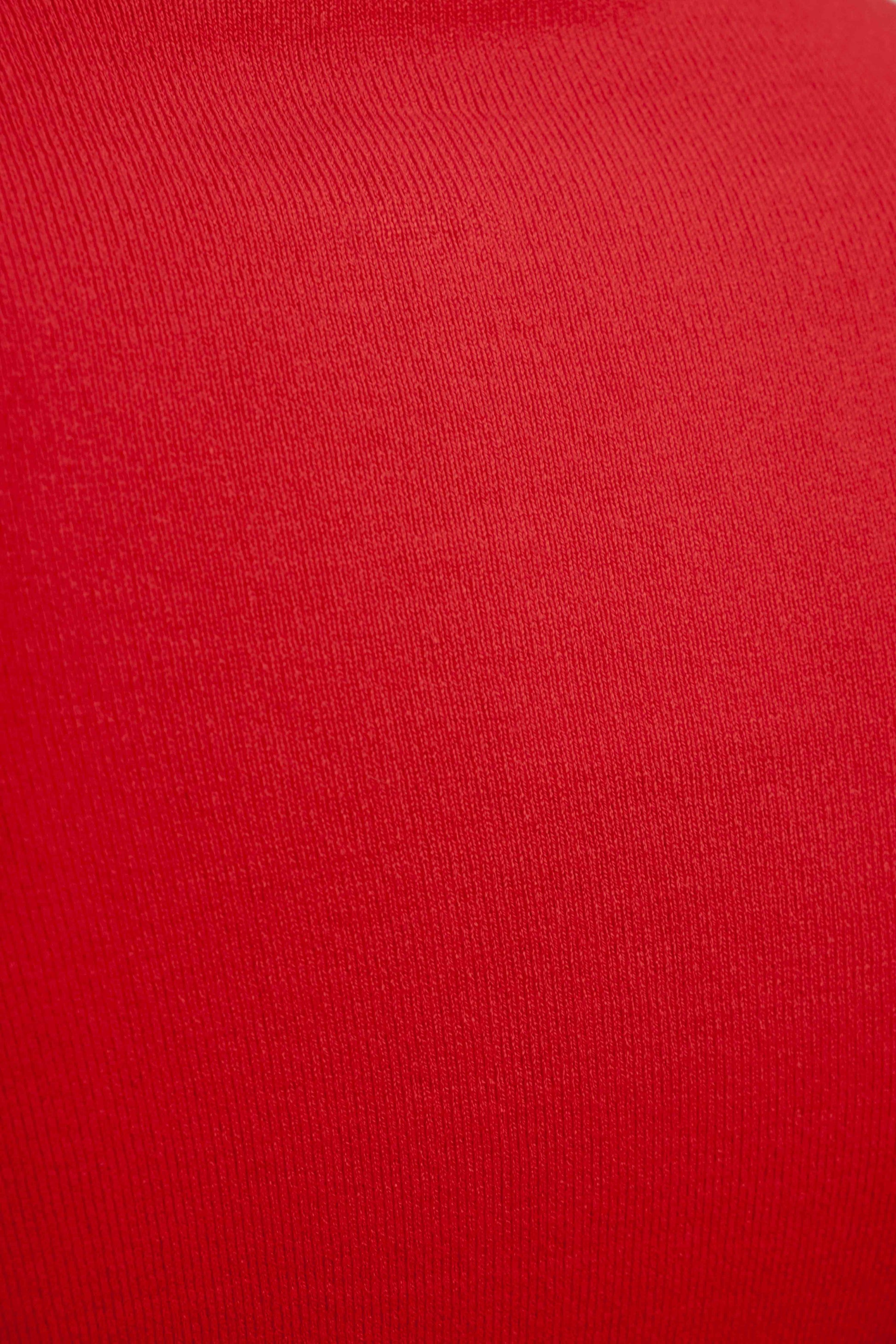 Jersey punto rojo cuello subido aberturas puños