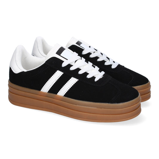 Zapatilla deportiva negra de mujer con doble suela, elegante y moderna.