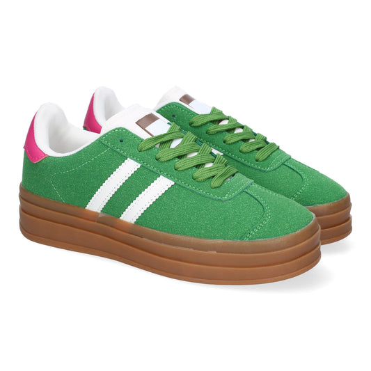 Zapatilla deportiva verde de mujer con doble suela, elegante y moderna.