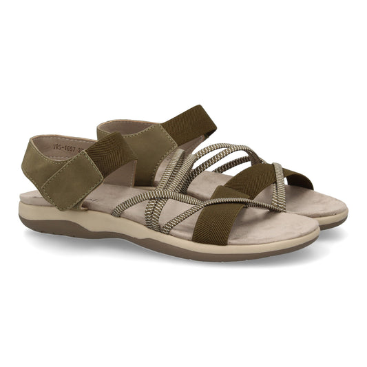 Sandalias planas de mujer color verde, con tiras elásticas cruzadas y cierre de velcro.