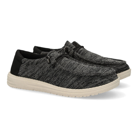 Zapatillas deportivas de hombre color negro. Diseño ligero con cordones elásticos y detalles de costuras.