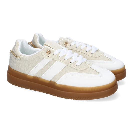 Zapatillas casual de mujer color beige con cremallera lateral. Calzado cómodo y moderno para uso diario.