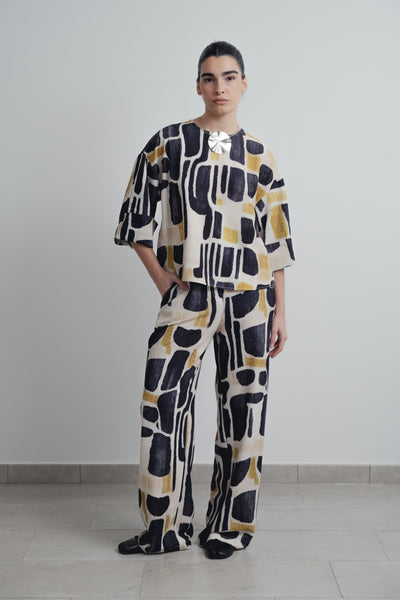 Pantalón fluido con estampado floral colorido de noche