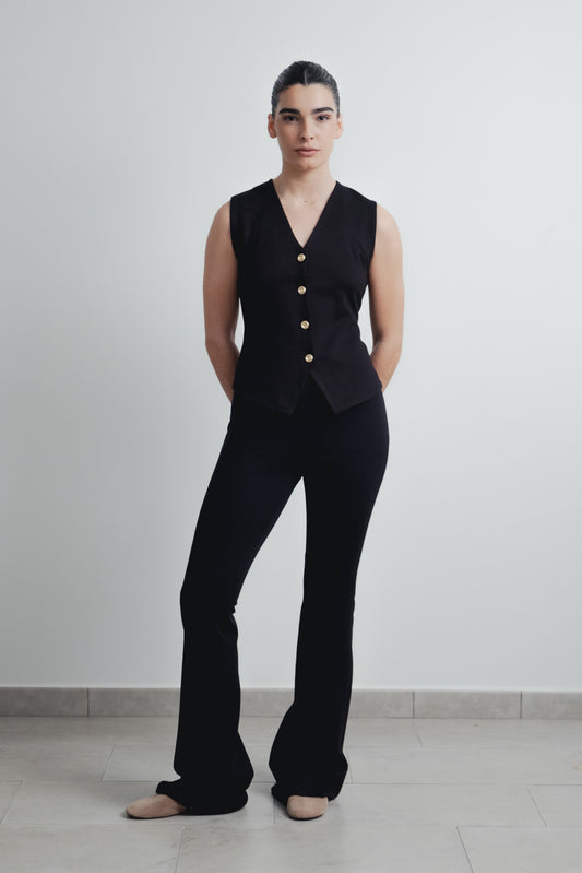 Pantalón negro de punto con textura y bajo acampanado estilo flare